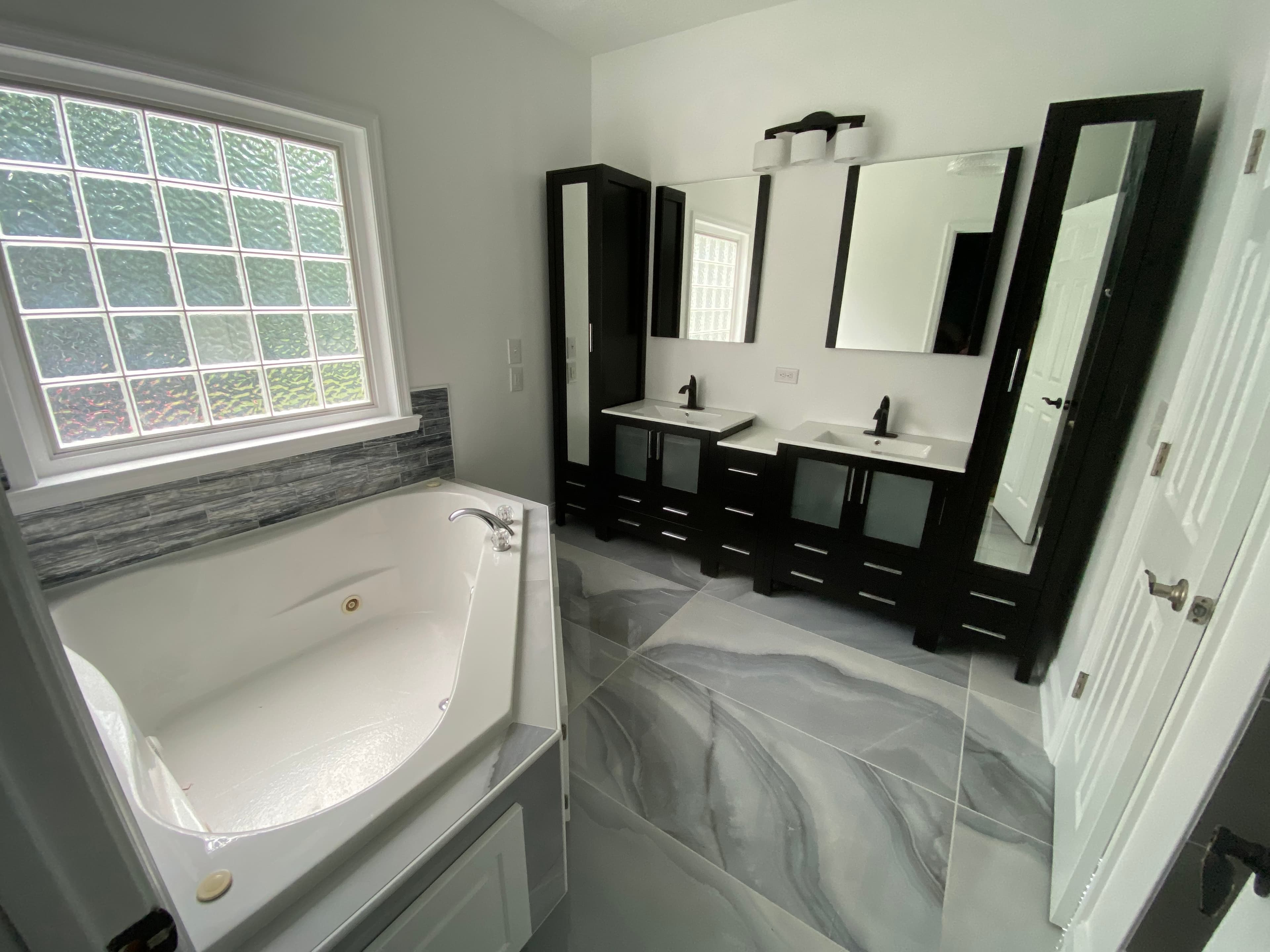 Luxury bathroom with soaking tub and double vanity modern design